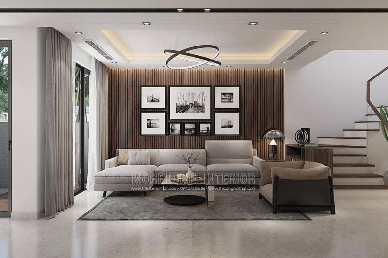 Thiết kế tường phòng khách đẹp độc đáo với gỗ ốp tường kết hợp tranh đen trắng canvas. Thiết kế biệt thự