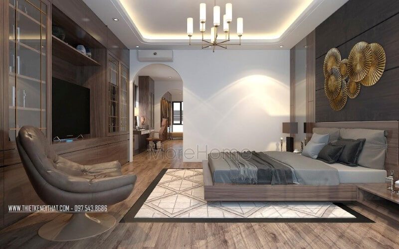 Không gian phòng ngủ biệt thự được trang trí bằng tone màu nâu trầm và chất liệu gỗ công nghiệp, tạo nên sự đồng bộ, sang trọng và không bị rối mắt.